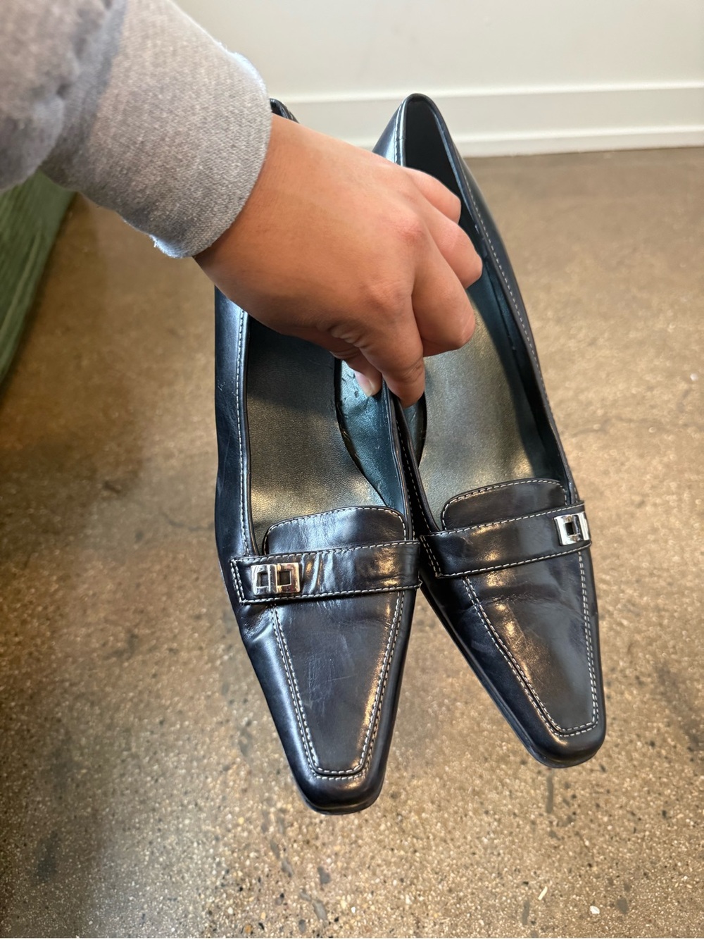 Anne Klein Black Pointed Leather Heels with Silver Buckle Accent